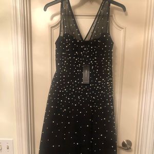 Black midi dress embellished with pearls. Brand new with tags.